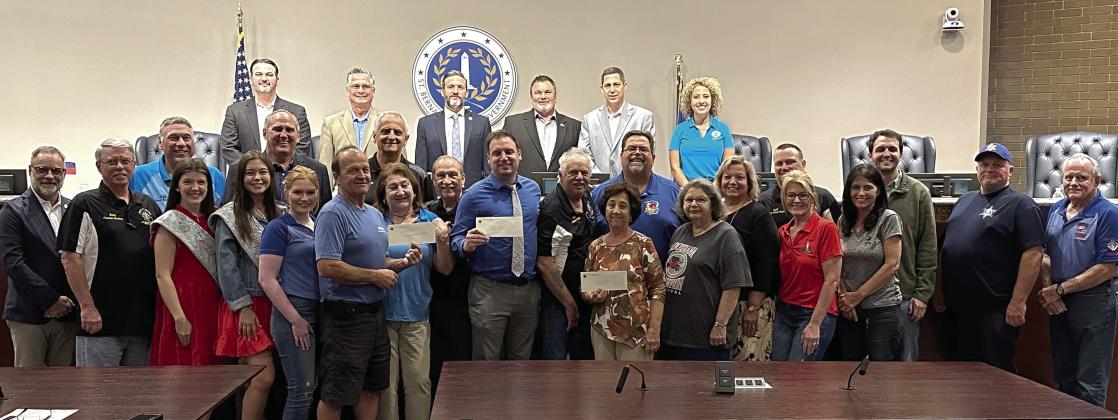 St. Bernard Parish Council and Parish President Guy McInnis accept check donations from the Knights of Columbus's Archbishop Rummel Council #5747.