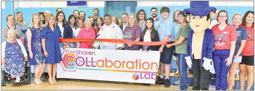 Our Lady of Prompt Succor teachers and students at the ribbon cutting for the school’s Collaboration Lab.