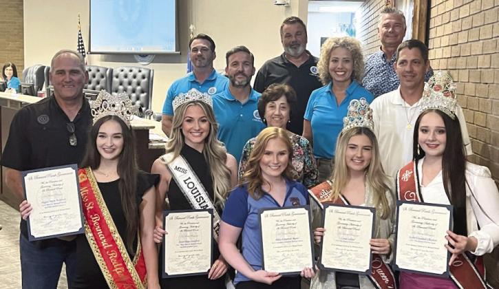 St. Bernard Parish festival queens pose with council members and parish president Guy McInnis as they accept their 'honorary citizen' proclamations.
