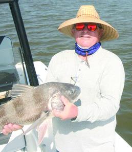 Cousin Rob Sporl with a black drum caught in the early morning.