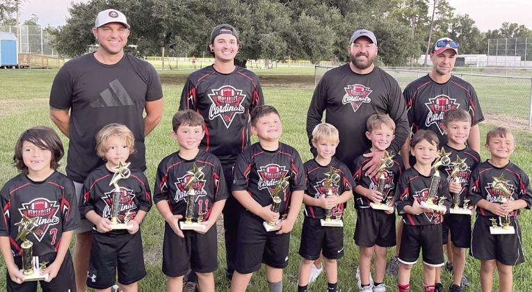 The Versailles Cardinals 5-year-old and 6-year-old Flag Football team were recently named champions! Team members are, first row, from left: Rowan Molina, Marcelo Molina, Jaxx Ellis, Lawson Argo, Trenton Riggio, Ronnie Hebert, Lance Taisant, Jay Gernados and Nathan Farley. Back row, from left: Coach Tommy Riggio, Coach Donald Ellis, Head Coach Ronnie Hebert and Coach Patrick Farley.