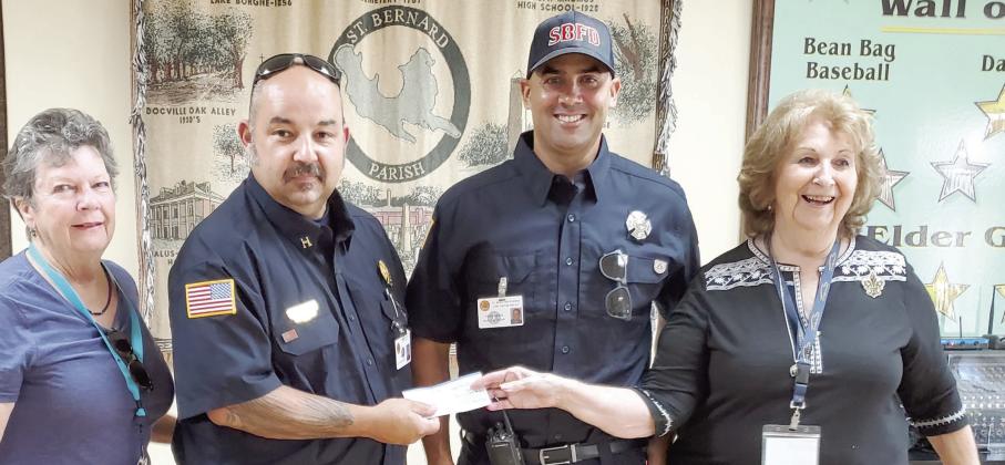 On August 26, the AARP Chapter 3926 presented a donation to the St. Bernard Fire Department for their Muscular Dystrophy Boot Drive. Per Caption Richard Steele, their Boot Drive will be held Oct. 6-8. Please stop at the traffic light at Judge Perez &amp; Packenham to donate for such a worthy cause. Pictured, from left: Glenda Fedele, (AARP Treasurer), Capt. Richard Steele, Capt. Desi Romano and Leona Galley (AARP President).